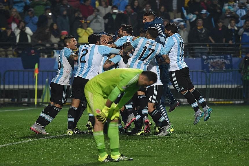 David Ospina kept Colombia in the game with superb saves, tipping over this header from Lionel Messi after first keeping out Sergio Aguero's effort. Carlos Tevez was not among the five designated penalty takers because of his miss in the 2011 Copa. B