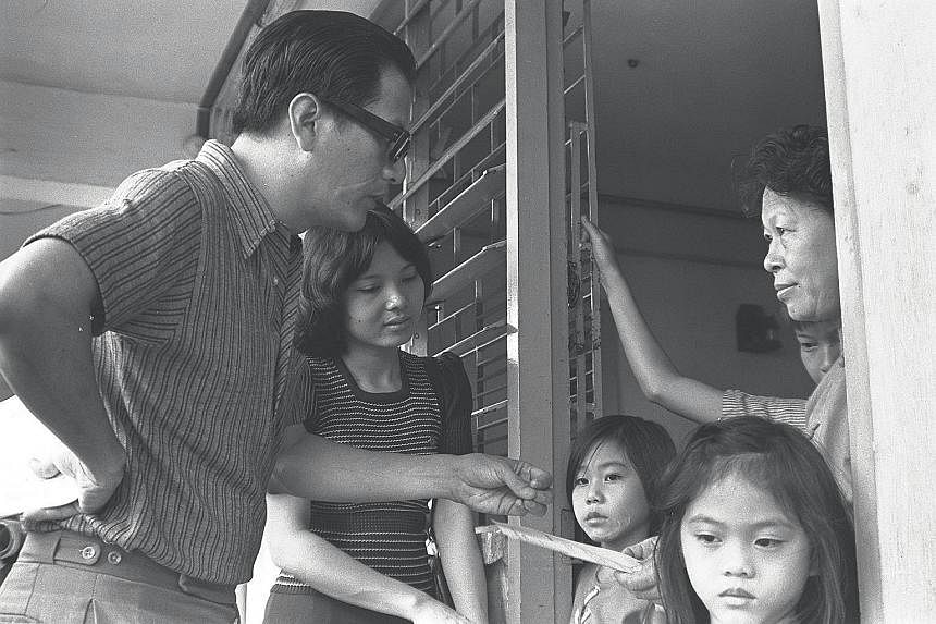 Phey Yew Kok on a door-to-door campaign in 1973 to publicise two new co-operative supermarkets to be built by Welcome. With him is former minister of state Yu-Foo Yee Shoon, who was then an NTUC industrial relations officer. Phey Yew Kok was charged 