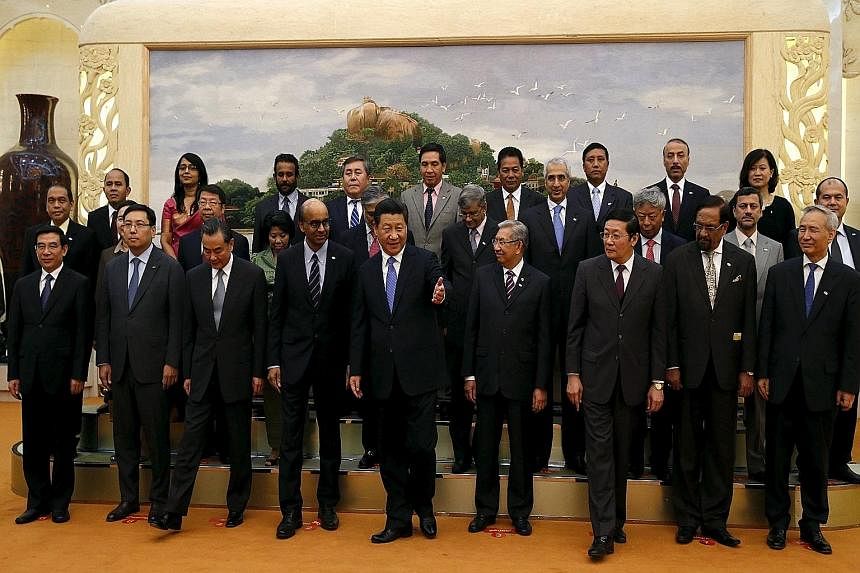 Chinese President Xi Jinping (centre) with guests, including Singapore's Deputy Prime Minister Tharman Shanmugaratnam (front row, fourth from left), at the Asian Infrastructure Investment Bank launch ceremony in Beijing last October. China is expecte
