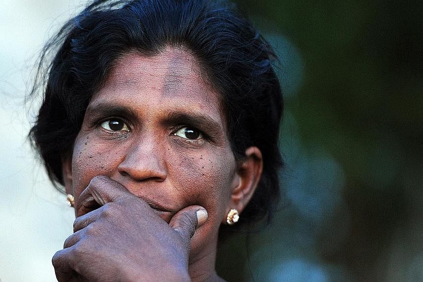 Ms Evin Selvy, who struggles to feed her family on her wages as a farm labourer, hopes the new government will improve life for her three daughters. Her husband was killed just before the separatist war ended in 2009.