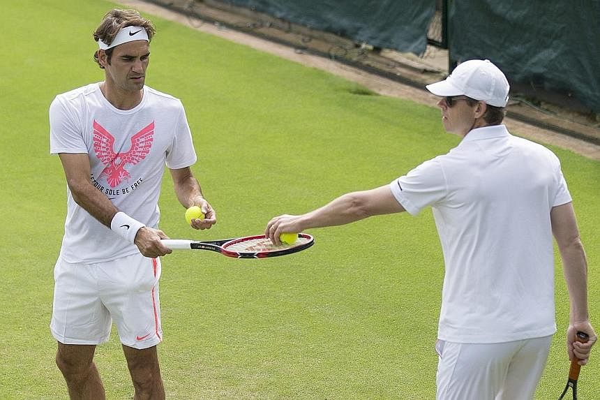 Swiss maestro Roger Federer (left), with coach Stefan Edberg in training, is not calling time on his career just yet even as he has not won a Grand Slam title since 2012. But he triumphed in Halle in the run-up to Wimbledon and feels that the partner