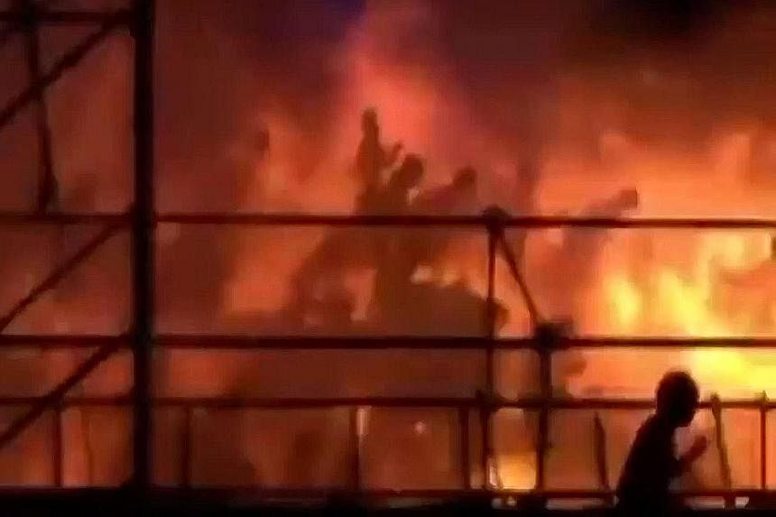 Video footage shows revellers being engulfed in flames after coloured powder that was sprayed on them ignited.
