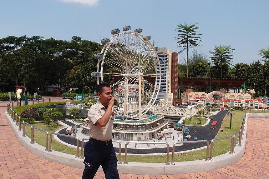 Park ranger Norirwan Abdul Kadir, 32, patrolling the Legoland theme park in Johor last week. Legoland Malaysia Resort says there are surveillance cameras around and park rangers and plainclothes security officers patrol the area.