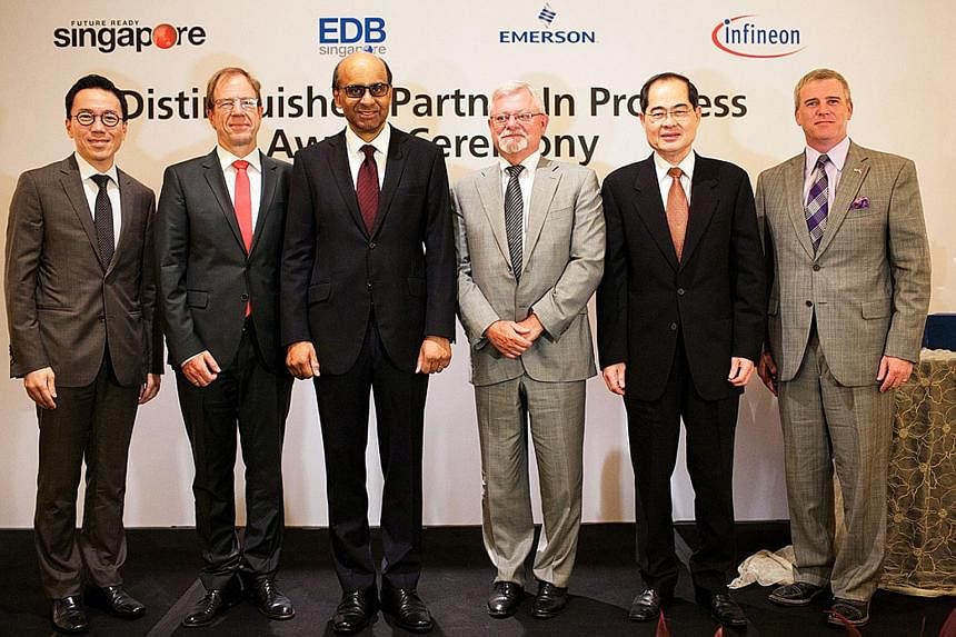 (From left) EDB chairman Beh Swan Gin; Infineon CEO Reinhard Ploss; Deputy Prime Minister Tharman Shanmugaratnam; Emerson's president Edward Monser; Minister for Trade and Industry Lim Hng Kiang; and United States Ambassador to Singapore Kirk Wagar a