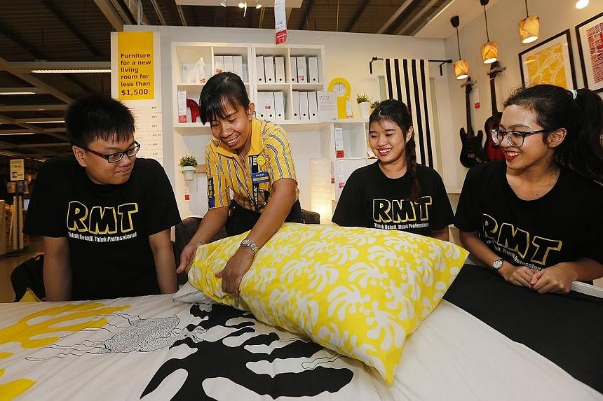 Ikea trainer Dublin Odita Par, 41, giving lessons in display to TP students (from left) Lee Chuan Jie, 21; Goh Ming Hui, 18; and Nur Atika Shir Khan, 17. The partnership will give students an inside look at one of the most successful retail operation