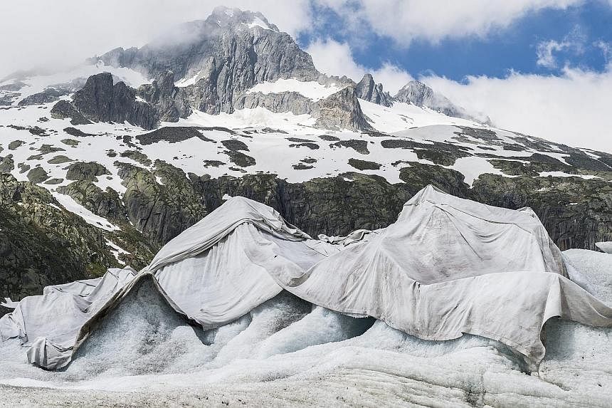 Tarpaulins covering the Rhone glacier near the Furka mountain pass in Switzerland. The glacier is protected by tarpaulins to keep the ice from melting faster.
