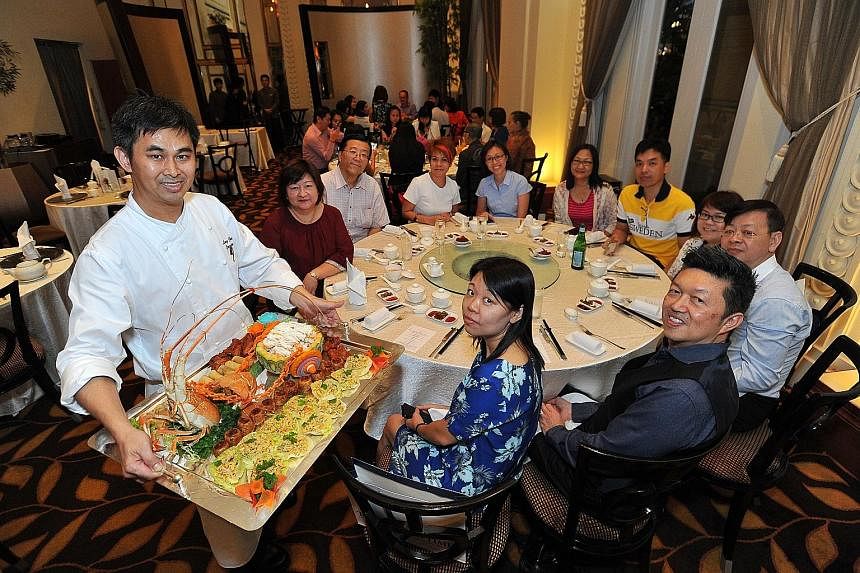 The 15 winners of ST170 Treats and their dining partners got to enjoy a meal co-curated by Jade Restaurant's chef Leong Chee Yeng (foreground, left) and Straits Times food critic Wong Ah Yoke (foreground, right).