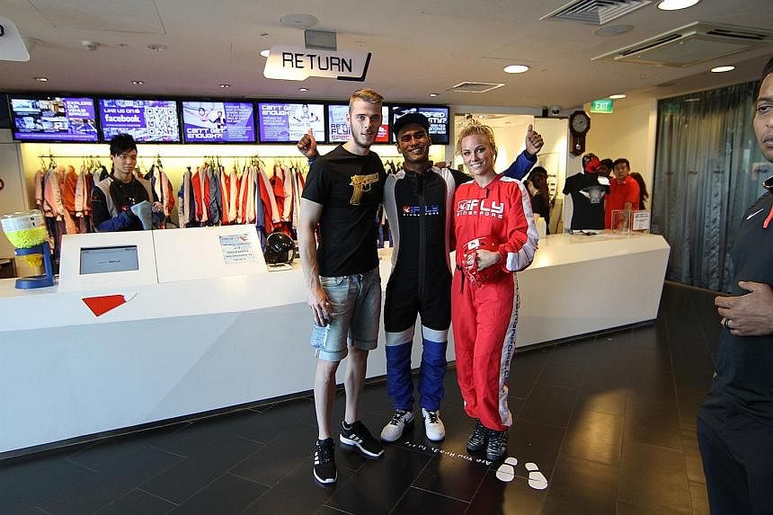 Manchester United goalkeeper David de Gea and pop-star girlfriend Edurne Garcia with iFly instructor Shakthi Subramaniam. For a player who loves diving acrobatically through the air, he did not enter the wind tunnel.