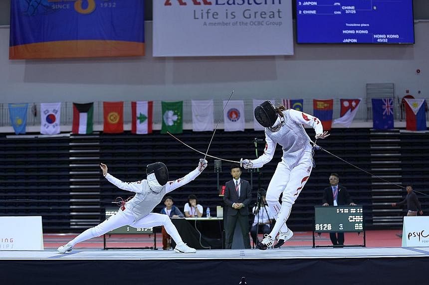 South Korea, with Lim Seung Min (left) aiming a strike at China's Gong Yu, proved stronger - for now - in the women's foil team final.