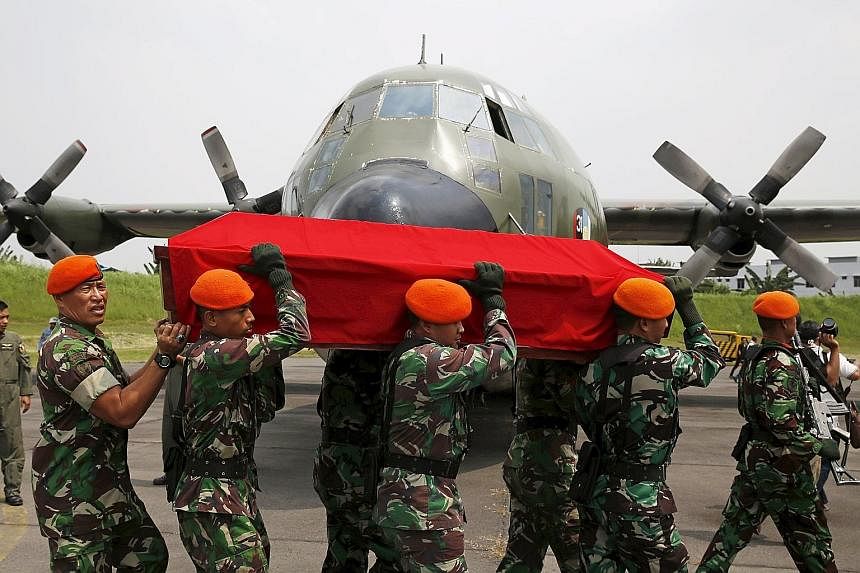 Indonesian soldiers carrying the coffin of a victim of the Hercules C130 crash on Wednesday. The air force's planes are mostly ageing, with many of its C130s hailing from the 1960s to 1980s.