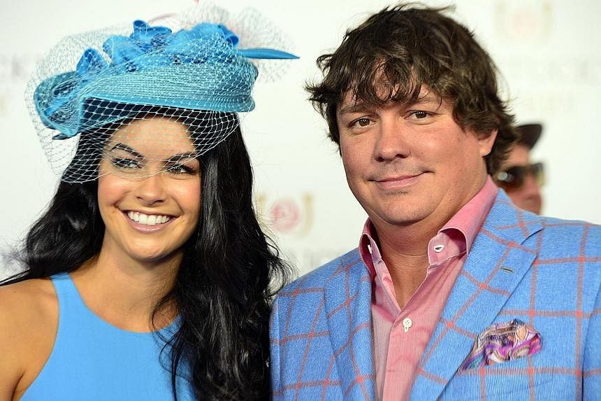 Amanda Boyd (left) and golfer Jason Dufner in happier days last year. The National Enquirer said Tiger Woods and Boyd had been dating for months and that he flew her to Seattle last month, ahead of the US Open.