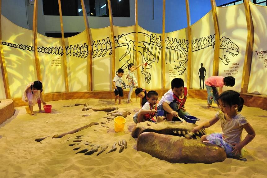 Children excavating ''dinosaur bones'' at the Dino Pit in Science Centre Singapore. Having a passionate and fun teacher who is not preoccupied with grades will go a long way towards inculcating a lifelong interest in science
