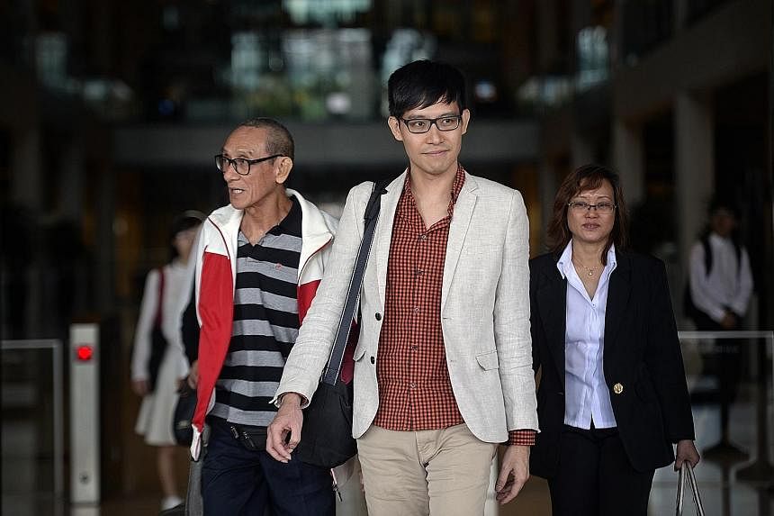 Mr Roy Ngerng leaving the Supreme Court with his father (left) yesterday, the last day of the three-day hearing to assess the amount of damages the blogger has to pay PM Lee.