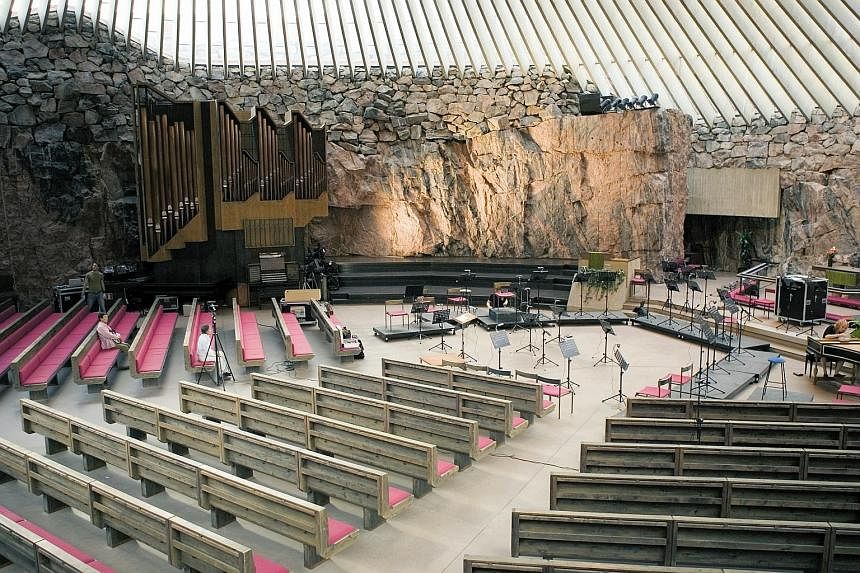 Temppeliaukio Church (Rock Church, above) is excavated into solid rock, while a Nordic walk (below) with skiing poles is a good way to explore the city and its suburbs.
