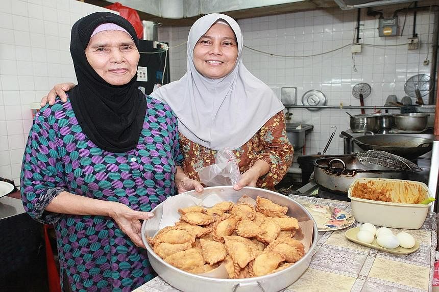 (Above) Mother Jamilah Karim's and daughter Aminah Abdul's curry puff recipe has remained the same for more than 20 years.