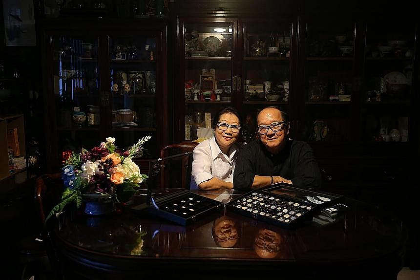 Retired couple Loh Ah Keong and Patsy Lee (both above) with the coolie currency. Mr Loh started collecting the porcelain currency in the 1970s. The porcelain pieces (left) are about the size of a dollar coin.