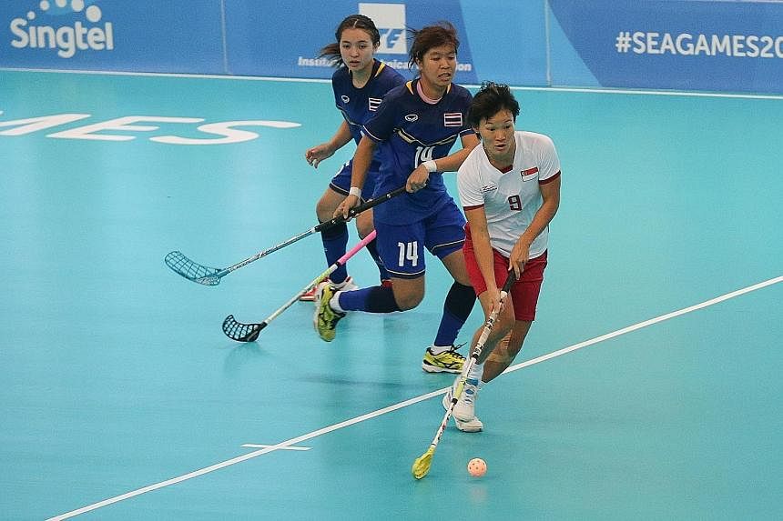 Singapore forward Jill Quek's stylish dribbles leaving Thai players trailing in her wake during the SEA Games floorball final, which the hosts won in a penalty shoot-out.