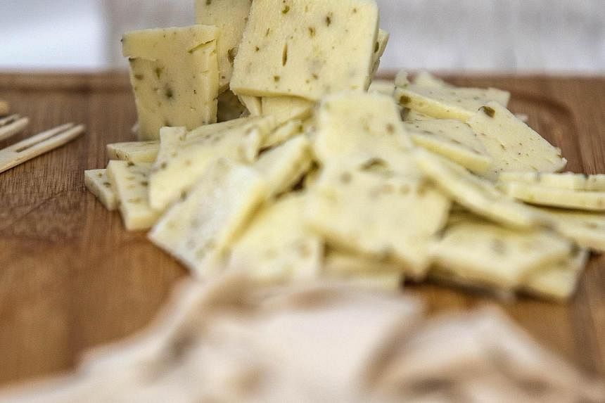Vegan cheese displayed during a vegan fair in Israel. New start-ups are using plant protein as substitutes for animal products, as well as using stem or other cells to replicate animal products.
