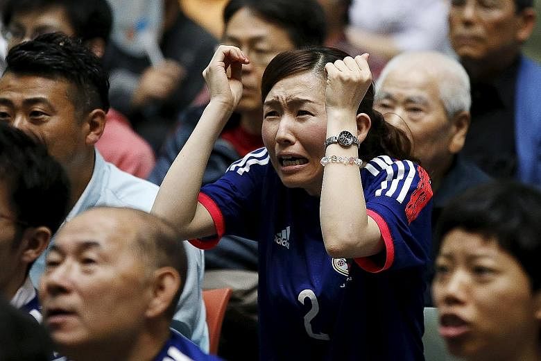 Fans, including those watching the final at a public viewing event in Tokyo, hailed the Japan team's fight-back from a disastrous start.