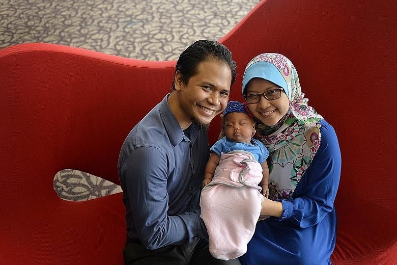 Mr Raihan Haji Rajin and Madam Siti Nurjannah with their daughter Hannah. Doctors had preserved part of Madam Siti's ovarian tissue and implanted it back after her recovery, to enable her to conceive naturally.