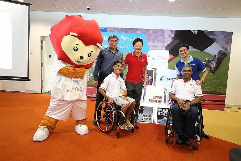(From left) Lim Teck Yin, chairman of the Singapore Asean Para Games Organising Committee, Mr Lawrence Wong, Minister for Culture, Community and Youth, and Philip Yuen, CEO of Deloitte Singapore, with paralympian Jovin Tan and Raja Singh, vice-presid