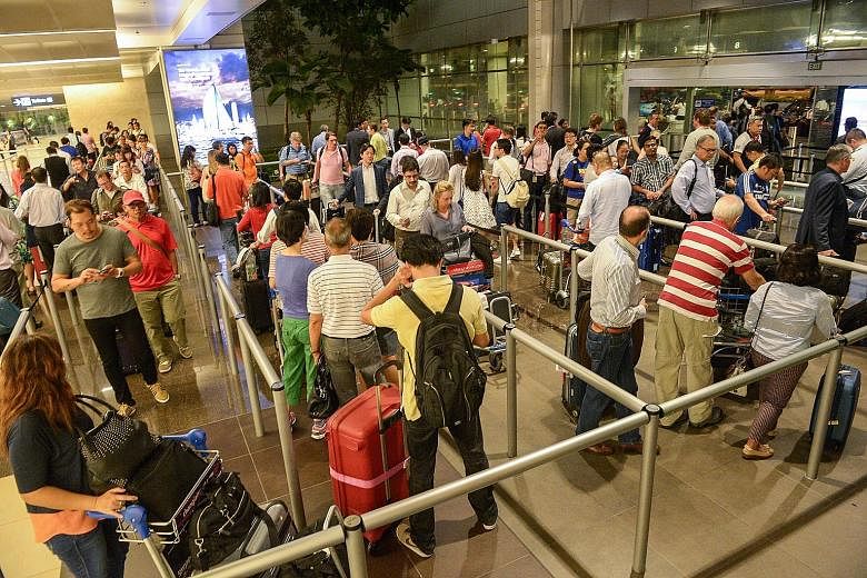 The queue for a taxi at Changi Airport's Terminal 2 at 10.50pm last Friday. Long queues may form at peak hours on some days but, even then, they tend to move quickly.