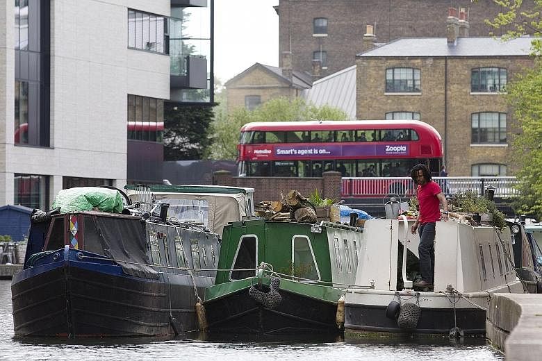 Canal boats in London, where the rising popularity of life on the water has caused congestion on the waterways, queues at locks and friction with residents whose homes line the canals.