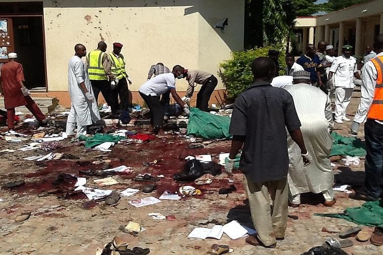 Rescuers and security agents searching for victims after a bomb exploded at a local government building in the Nigerian the city of Zaria, in Kaduna state, on Tuesday. At least 25 people were killed, the state governor said. That same day, a suicide 