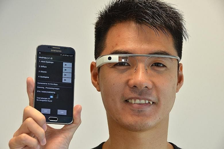 Senior research engineer Chia Shue Ching, from the Institute for Infocomm Research, with the glasses, which are linked to a smartphone. He was part of the team which developed the two applications to assist the elderly.