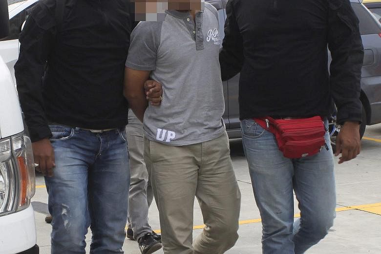 Counter-terrorism officers arresting a suspect in Kuala Lumpur, in a handout photo from Malaysian police. Senior ISIS leaders in Syria are giving direct orders to launch attacks, in a worrying trend.