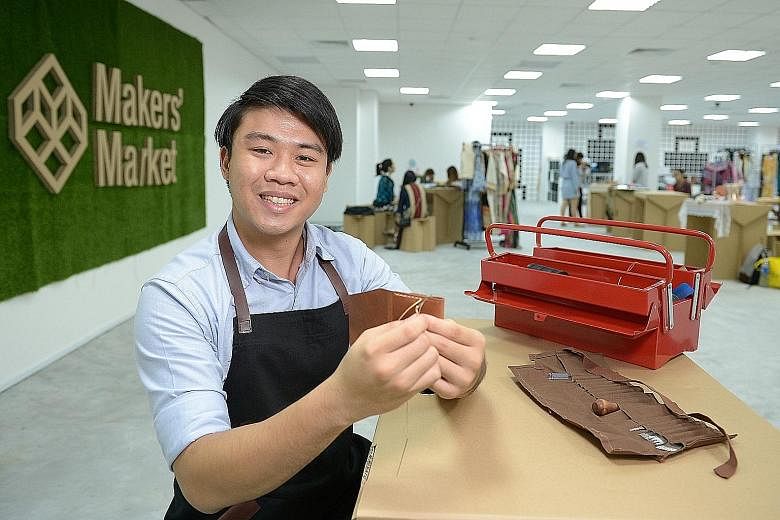 Mr Sylvester Ng (right) enjoys working with leather, making wallets and cardholders (far right) with the material.
