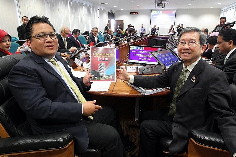 Public Accounts Committee chairman Nur Jazlan Mohamad and his deputy Tan Seng Giaw with an interim report on 1MDB.