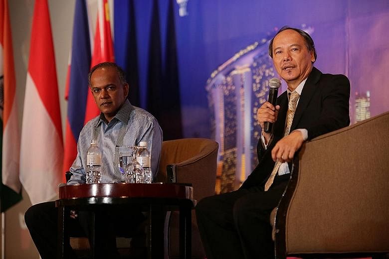 Mr K. Shanmugam with Dr Lim Lan Yuan at the dialogue session yesterday. The minister tackled questions on topics ranging from property cooling efforts to the Greek debt crisis and the stock selldown in China.