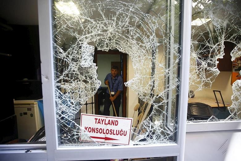 A broken window of the Thai honorary consulate after an attack this week in Istanbul.