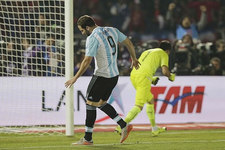 Striker Gonzalo Higuain (left) did not have a memorable Copa America campaign, missing his penalty kick against Chile in the final.
