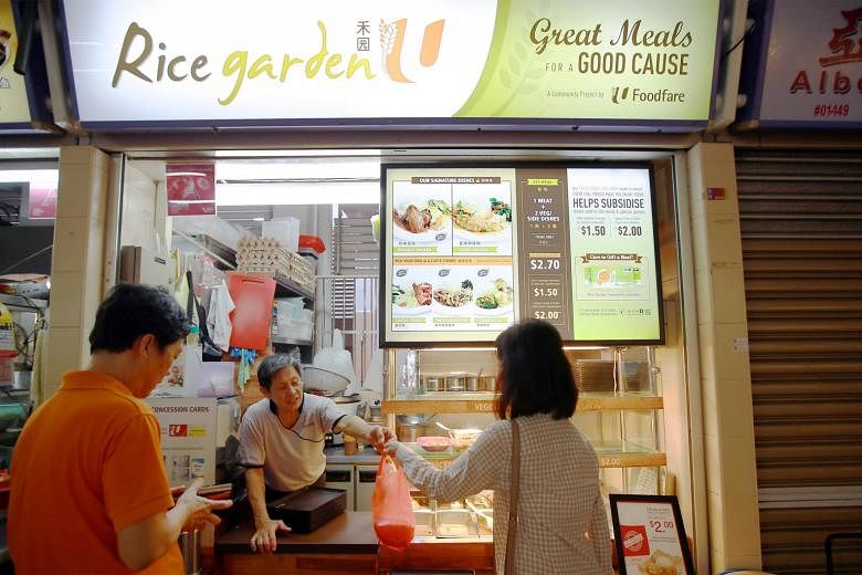 Stallholder Loh Joo Heng, 58, at the Rice Garden stall in Old Airport Road hawker centre. The outlets offer budget fare as well as meals at lower prices for those on public assistance schemes.