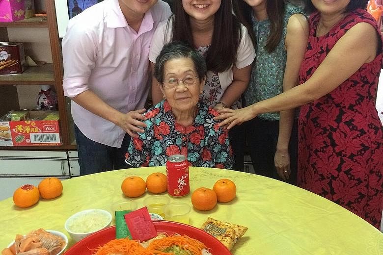 Mr Benedict Lo (far left) with his grandmother Tan Giok Kit, (standing, from left) younger sister Grace, wife Lim Pei Li and mother Tan Lee Yong at this year's Chinese New Year gathering. Mr Sebastian Tan and his daughter, Kaizaree Jade-Eden, whom he