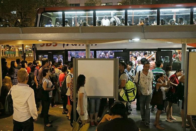 Commuters at Lavender Station, who were directed to the nearest bus stop, found that many people were ahead of them, including those from nearby stations such as Bugis. This led to huge crowds waiting to board the buses. SMRT staff putting up a sign 