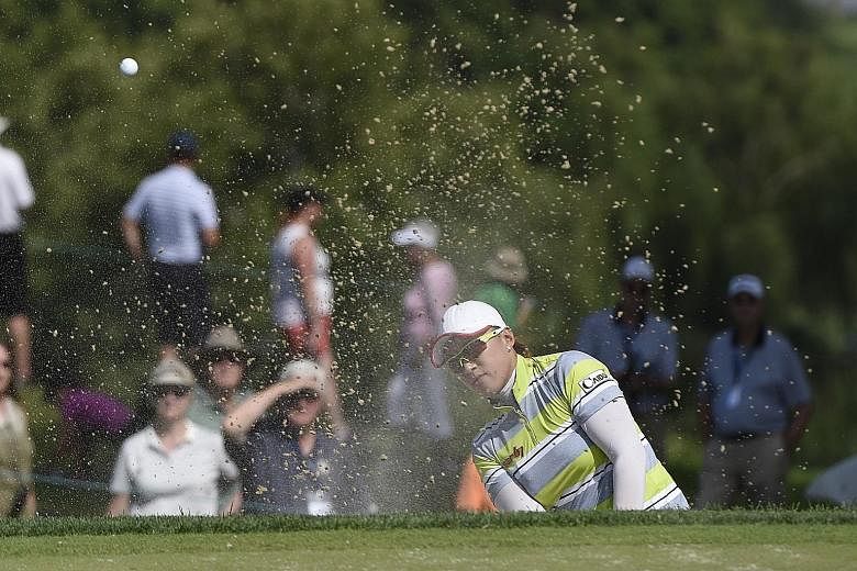 Amy Yang, shooting from a bunker on the ninth hole during the second round of the US Women's Open, could be on her way to claiming her first Major triumph after posting a three-shot lead at the halfway stage.
