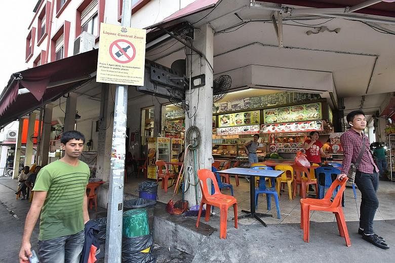 The new limits on alcohol sales are more stringent in Geylang (above) and Little India. Some neighbourhood stores that used to stay open till midnight are now closing earlier as they cannot sell liquor.