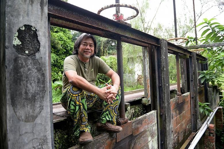 Mr Tay Lai Hock (left) founded his eco-community to create a "21st century kampung culture" here.