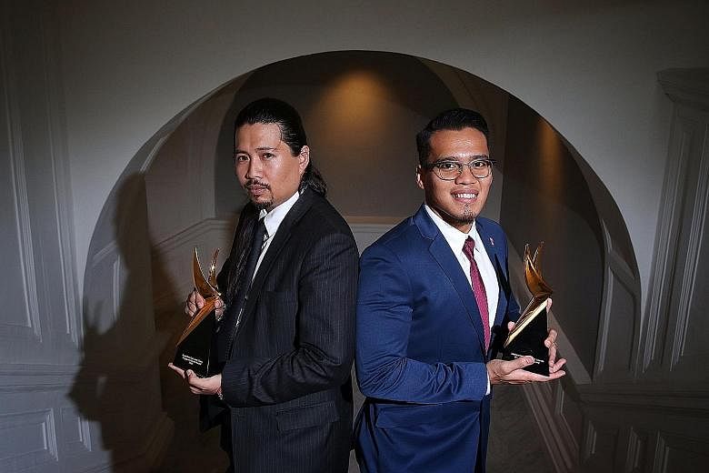 Lawyer Josephus Tan, 35 (left), and silat star Muhammad Shakir Juanda, 26, were among five people who received the Singapore Youth Award at the Victoria Concert Hall yesterday.