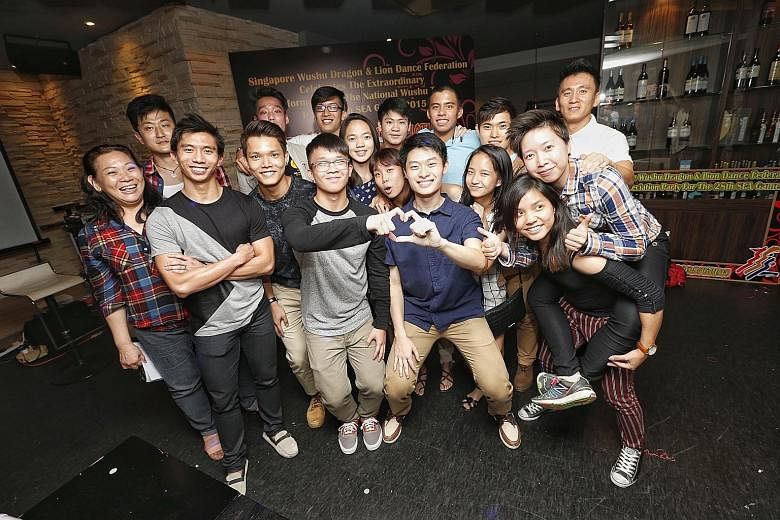 Members of the national wushu team enjoying the chance to let their hair down during last night's celebration dinner by the Singapore Wushu Dragon & Lion Dance Federation at Temasek Club. The Republic's exponents bagged six golds at the 28th SEA Game