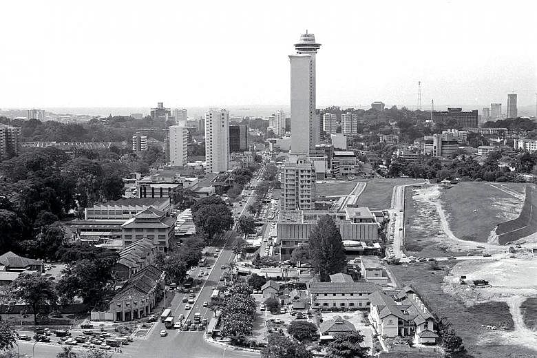 THEN AND NOW: An aerial shot of Orchard Road taken from the Hilton Hotel in 1973, and Orchard Road today as seen from the roof of Shaw House.