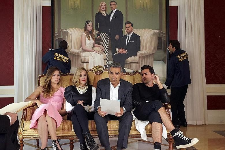 Rhona Mitra in The Last Ship (above). The Schitt's Creek family is played by (from far left) Annie Murphy, Catherine O'Hara, Eugene Levy and Daniel Levy.