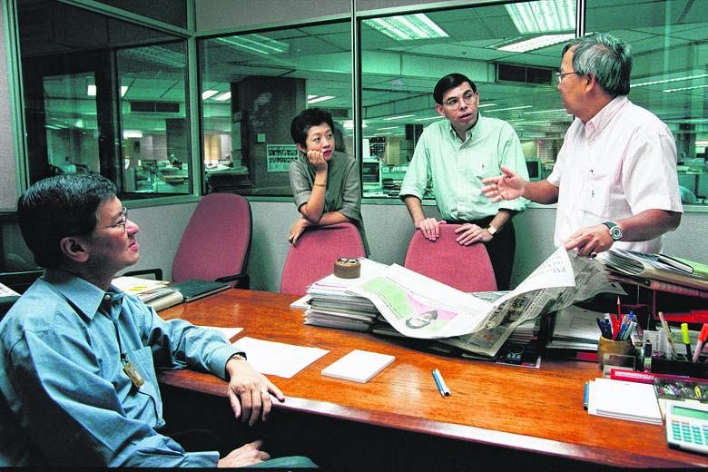 (From right) Mr Leslie Fong holding a story conference with news editor Warren Fernandez, TV news editor Jennifer Lewis and associate editor Bob Ng in October 2000. Mr Fong was appointed editor of The Straits Times in 1987 at age 37. (Above left) Mr 