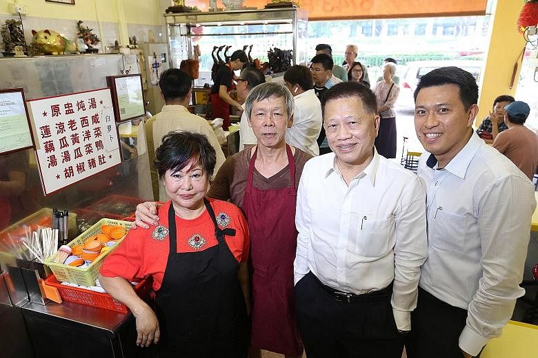 (From left) Madam Betty Kong and her husband Ha Wai Kay, who built up Kay Lee Roast Meat Joint, with Aztech Group chairman Michael Mun, who bought it for $4 million, and his eldest son Jeremy Mun.