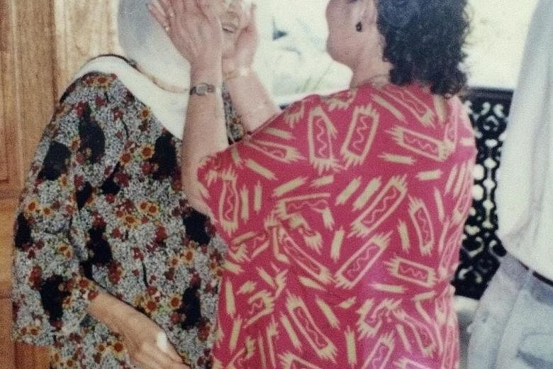 Maria Hertogh, or Nadra Ma'arof (right), reunited with her elder adoptive sister Kamariah Mohd Dahan in Terengganu (left) and niece Rokayah Yusof.