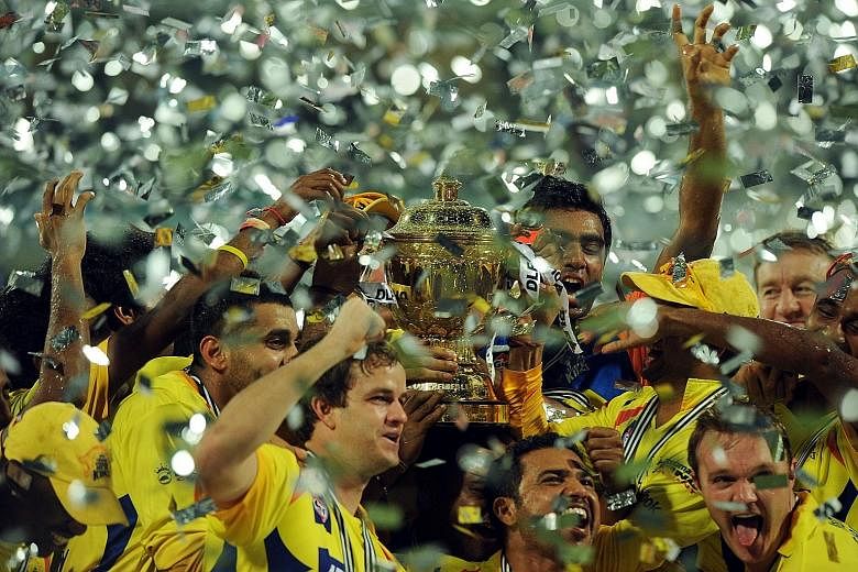In this May 2011 photograph, Chennai Super Kings players celebrate their IPL Twenty20 cricket triumph. With the Kings and Rajasthan Royals now drawing a heavy punishment as a result of their owners indulging in illegal betting, the issue of whether t