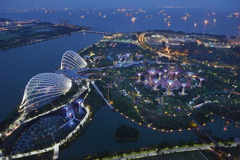 Managers of the Gardens by the Bay (left) project awarded contracts of more than $20 million that waived competition without compelling reasons. The way the NLB (top right) procured electronic resources led the ministry to refer the matter to the pol